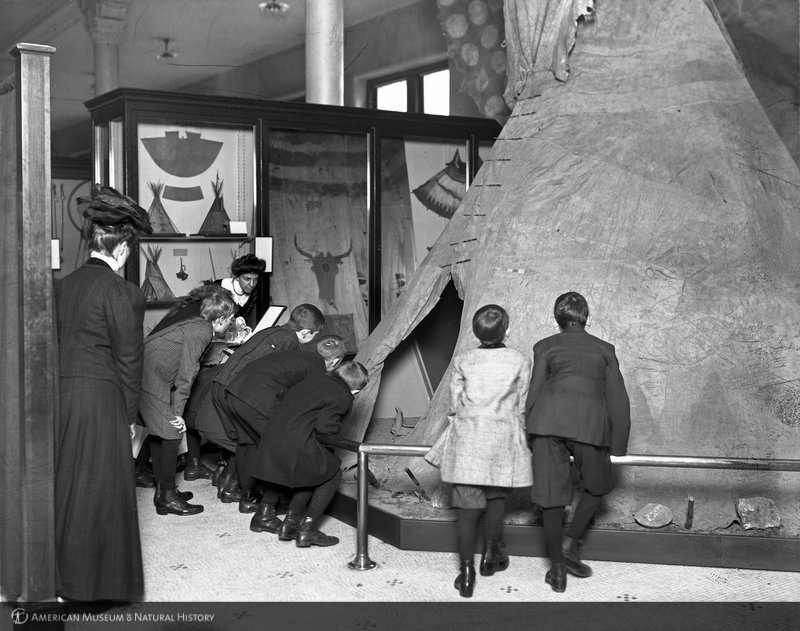 Viewing Indians of the Plains exhibit with Museum instructor, 1908