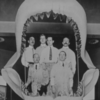 Paleontology staff posing with fossil shark jaw restoration, circa 1909