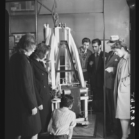 Group of visitors looking at the seismograph, American Museum of Natural History, 1943